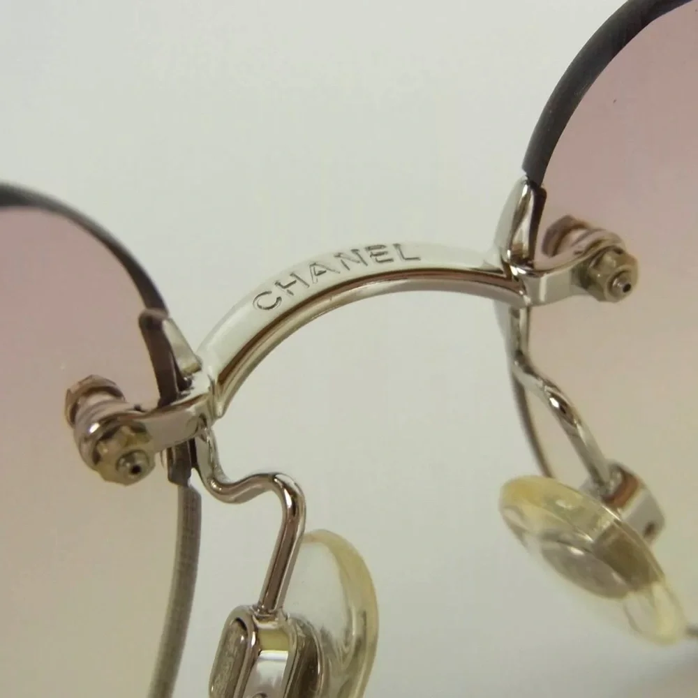 CHANEL Silver Temple Rimless Sunglasses with Pink Gradient Lenses